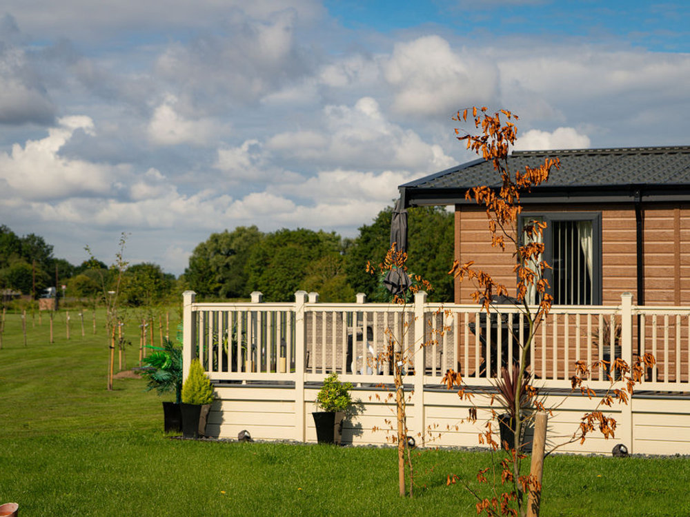 Lodge beside open countryside at Wild Rose Country Park