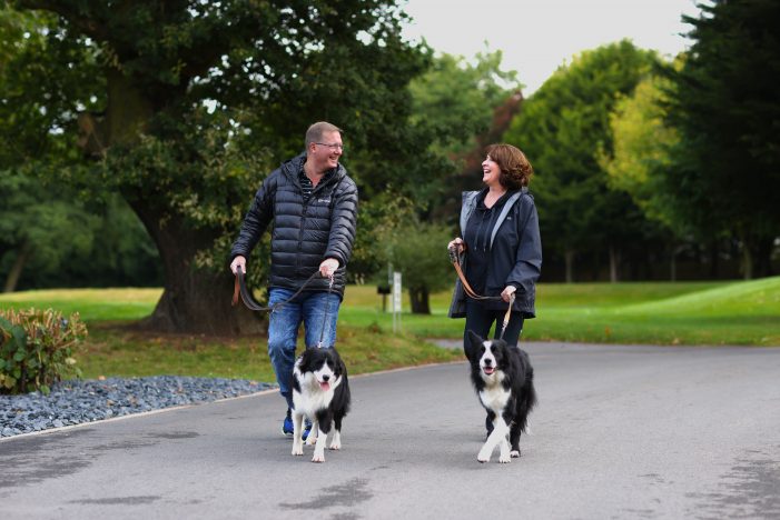 Man and woman walking their dogs at Allerthorpe Golf & Countrypark